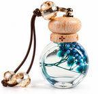 Car home perfume bottle, glass with blue dried flowers, close-up