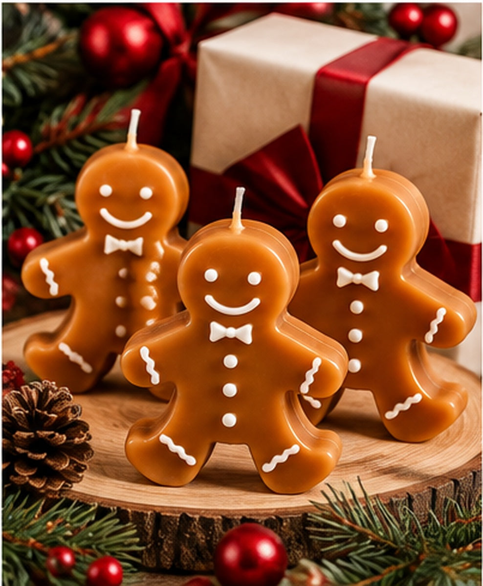 Three gingerbread candles on a wood slice